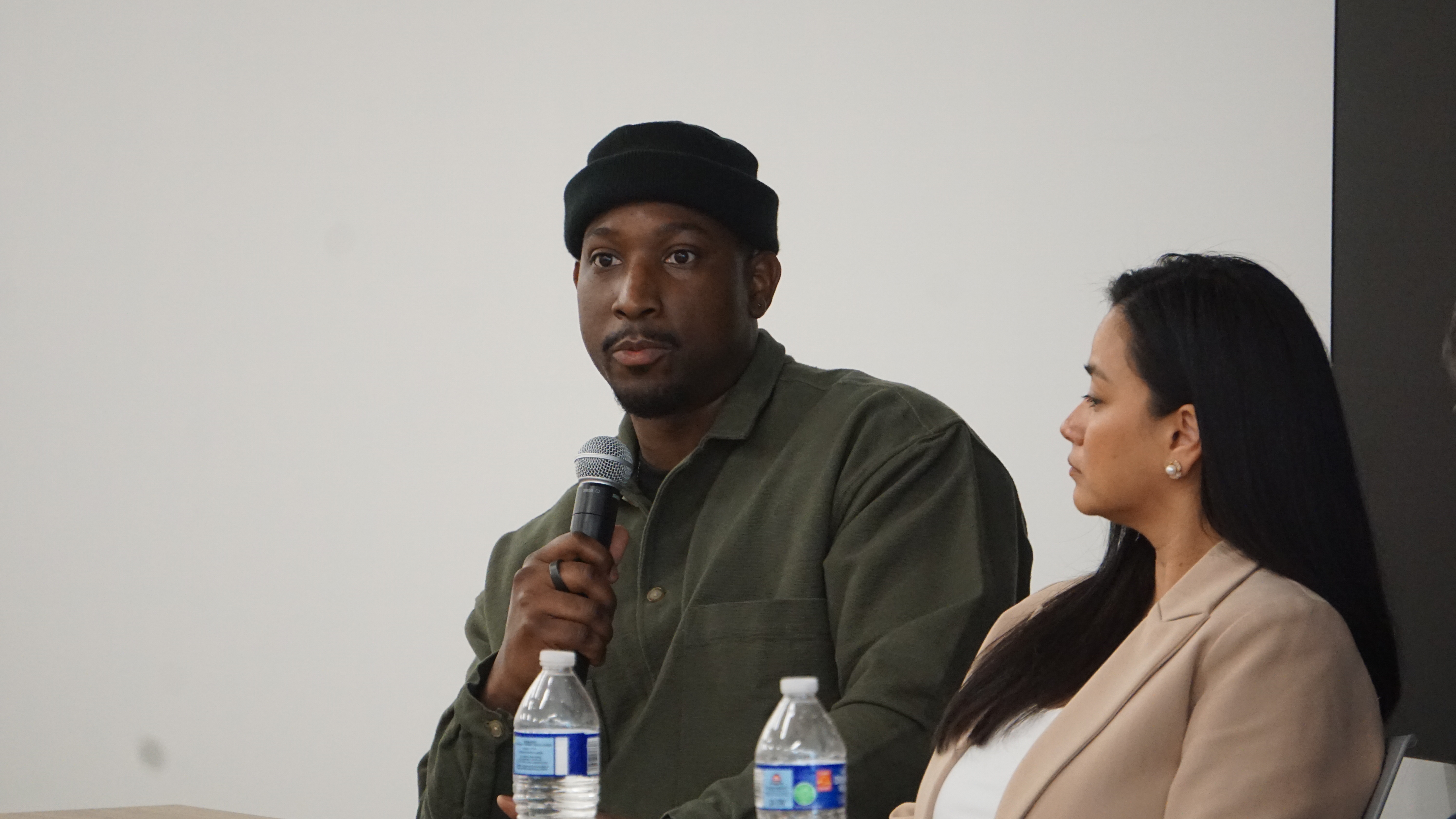 Temitayo on the mic at the College Broadcast News Workshop panel